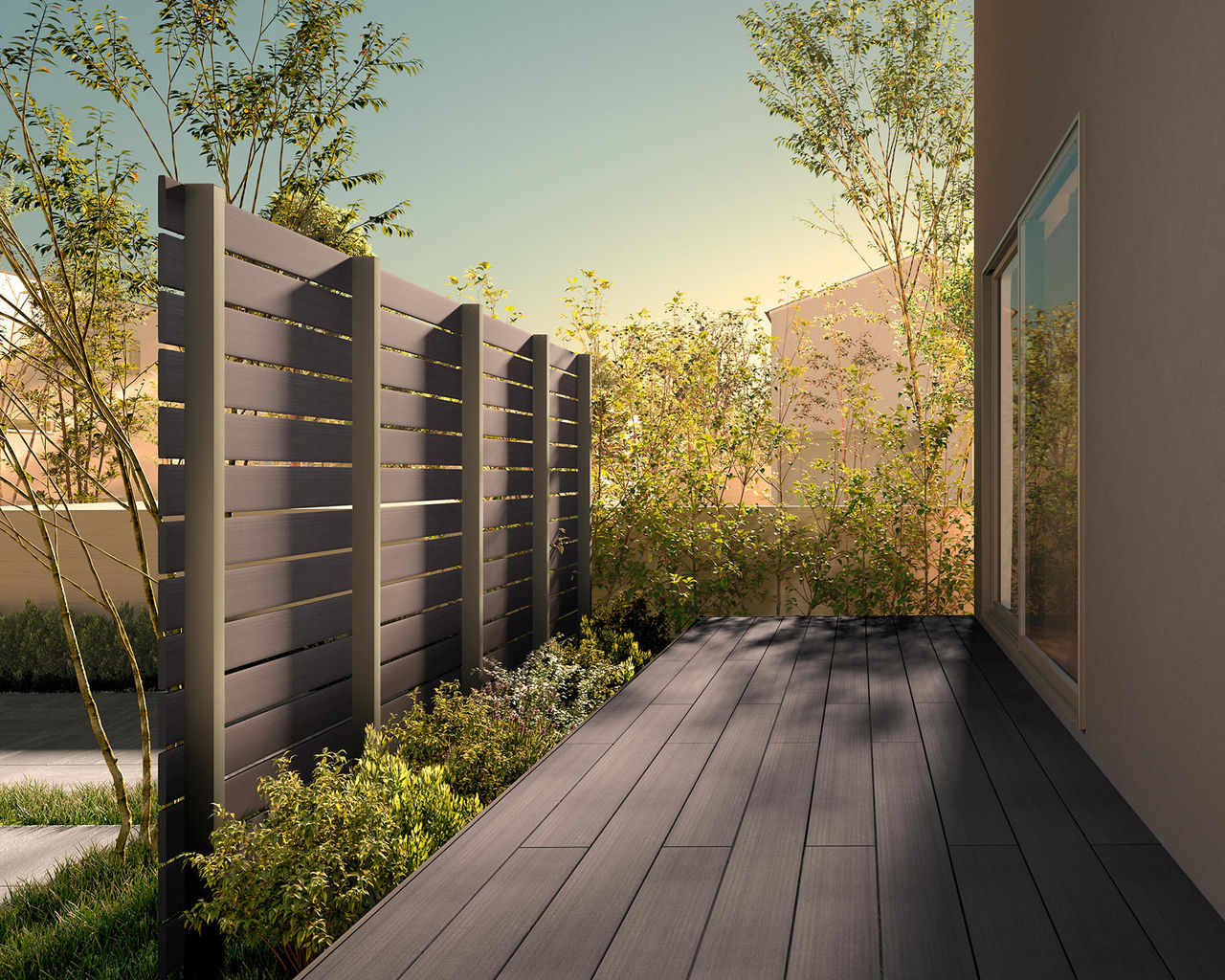 SCENE 02 デッキとのカラーコーディネートで統一感を演出 デッキと同色でコーディネートすることで目隠し効果と一体感を両立したデッキスペースに。　LIXIL　門・フェンスまわり　フェンス・スクリーン　目隠し　モダン　おしゃれ　エクステリア　愛知・名古屋の外構専門店パートナーホームのエクステリア　製品一覧　フェンスAW　|パートナーホーム