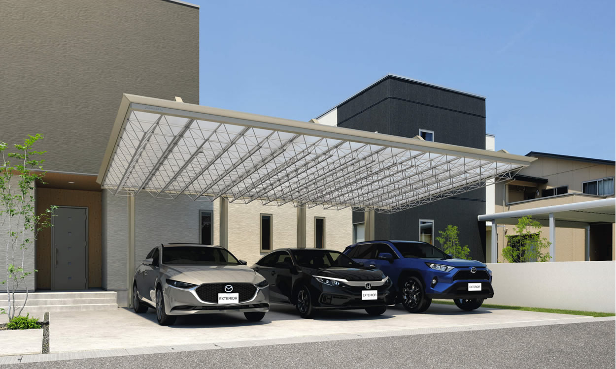 広いカースペースに映えるトラスデザインが上質で開放感のある空間を演出。 スタイリッシュなM.シェードIIの個性的なフォルムがシンプルな住宅外観の印象をグレードアップ。3台駐車が可能な大きな間口サイズでも、上吊りタイプとトラスの繊細な意匠が軽快さを生み、全体を上品な印象にまとめています。　三協アルミ　車庫まわり　カーポート　モダン　おしゃれ　エクステリア　愛知・名古屋の外構専門店パートナーホームのエクステリア　製品一覧　カーポート　M.シェードⅡ上吊りタイプ　施工イメージ|パートナーホーム